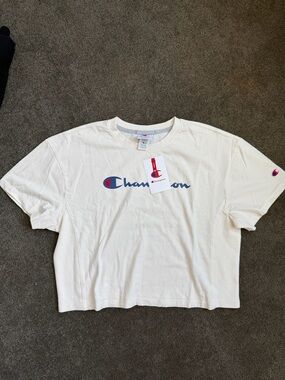 Champion Off-White Cropped Tee with Blue Script and Red Tag Accent